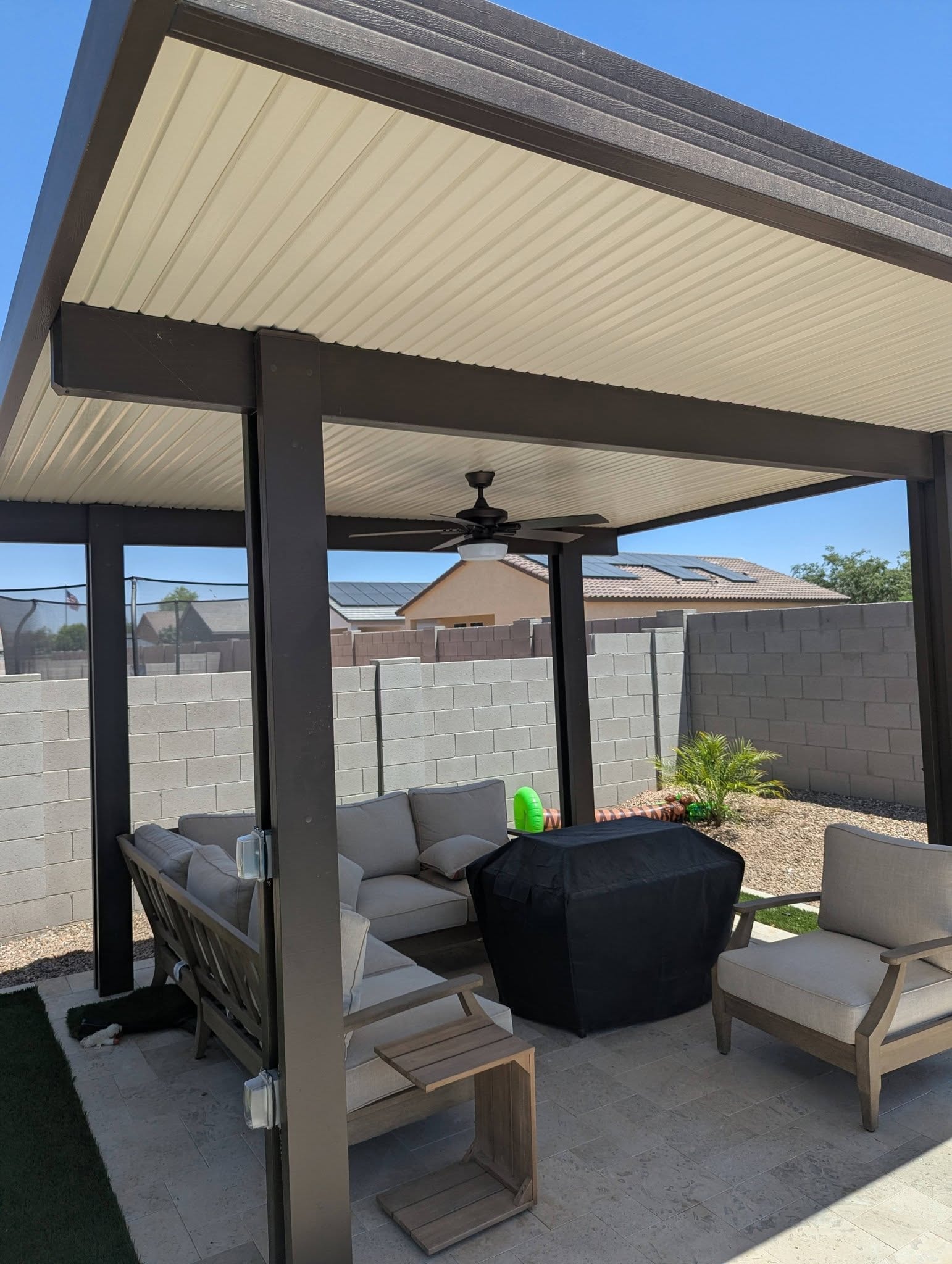 Covered patio structure and outdoor improvements.