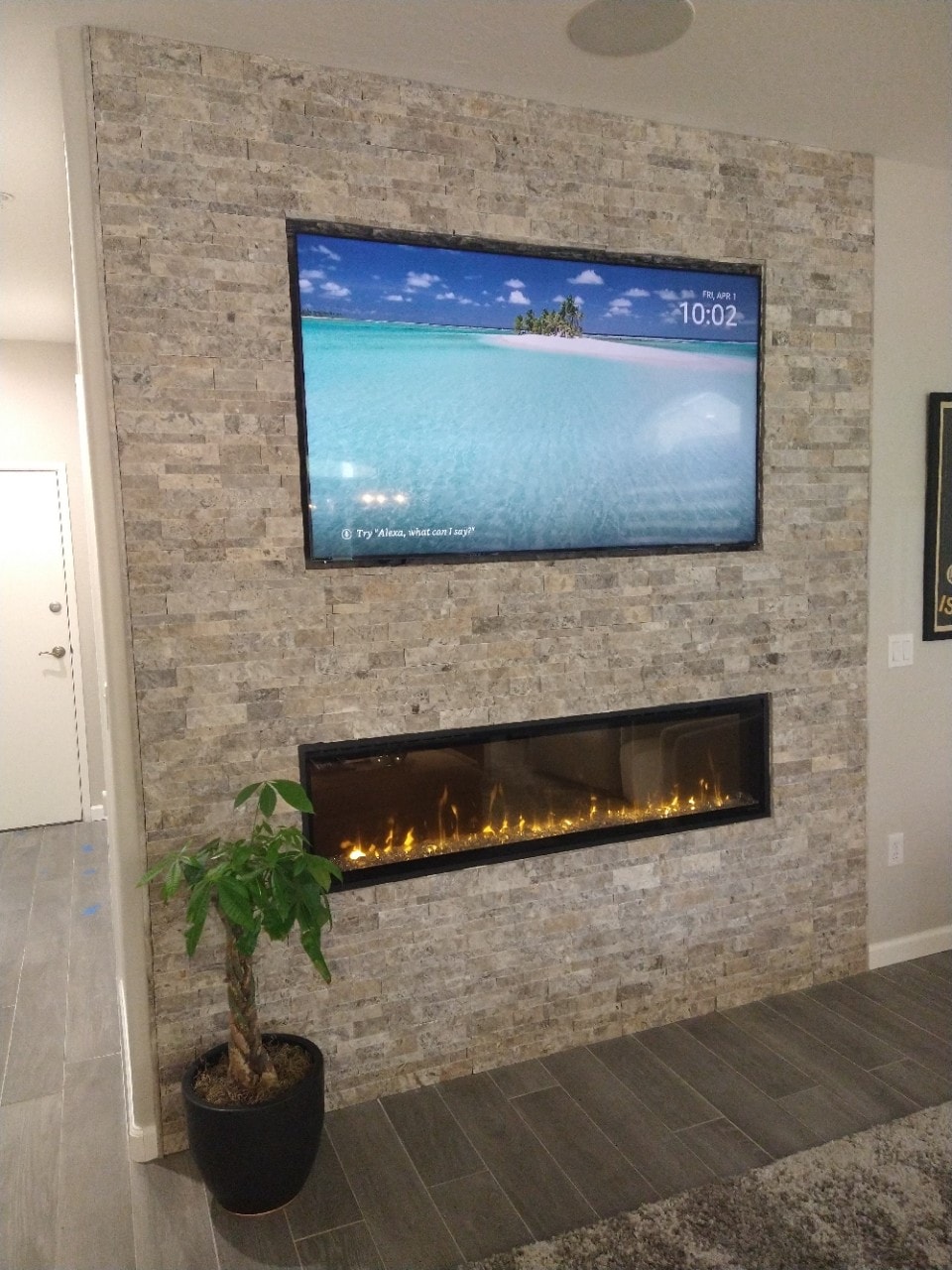 Television and fireplace wall installation.